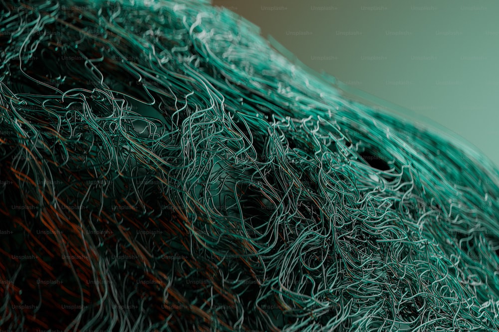 a close up of a piece of green wire