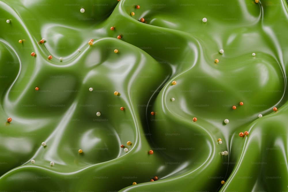 a close up of a green substance with tiny yellow dots