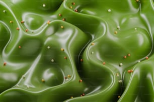 a close up of a green substance with tiny yellow dots