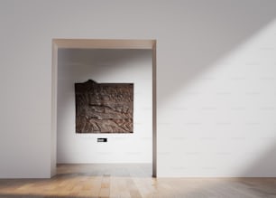 una habitación con suelo de madera y pared blanca