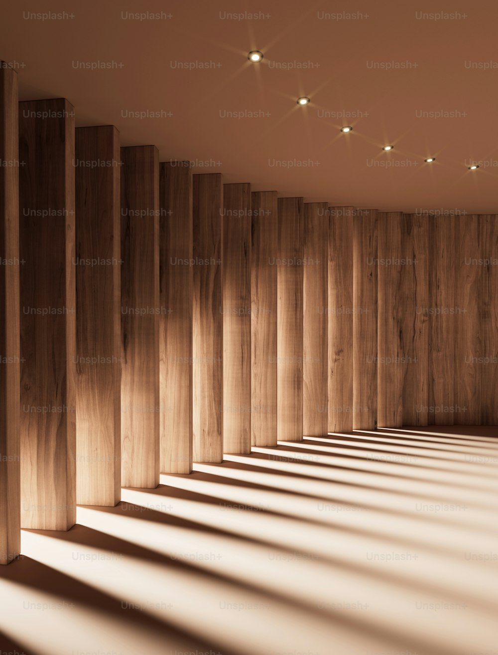 a long row of wooden columns in a room