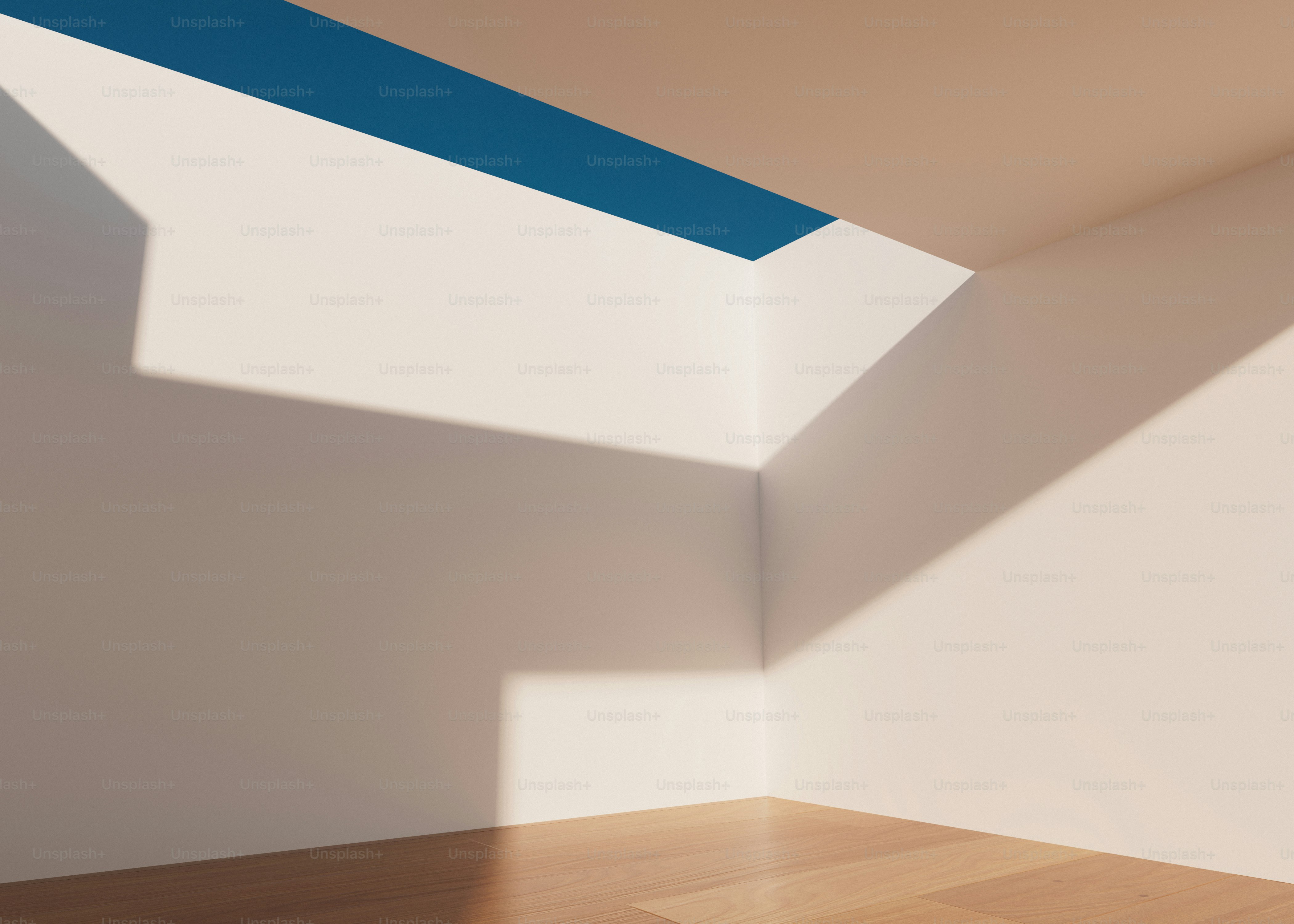 a room with a wooden floor and white walls