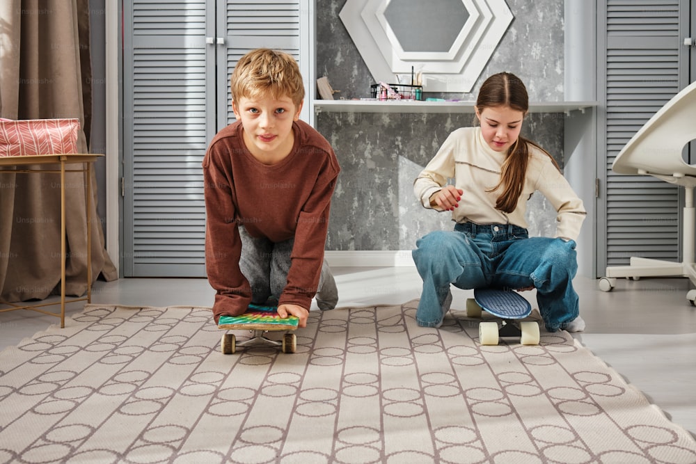 a boy and a girl playing with a skateboard