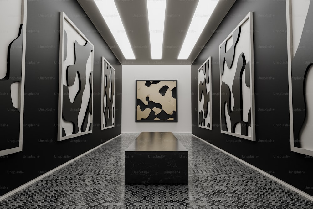 a black and white hallway with paintings on the wall