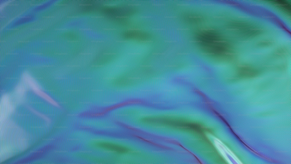 uma imagem desfocada de um fundo azul e verde