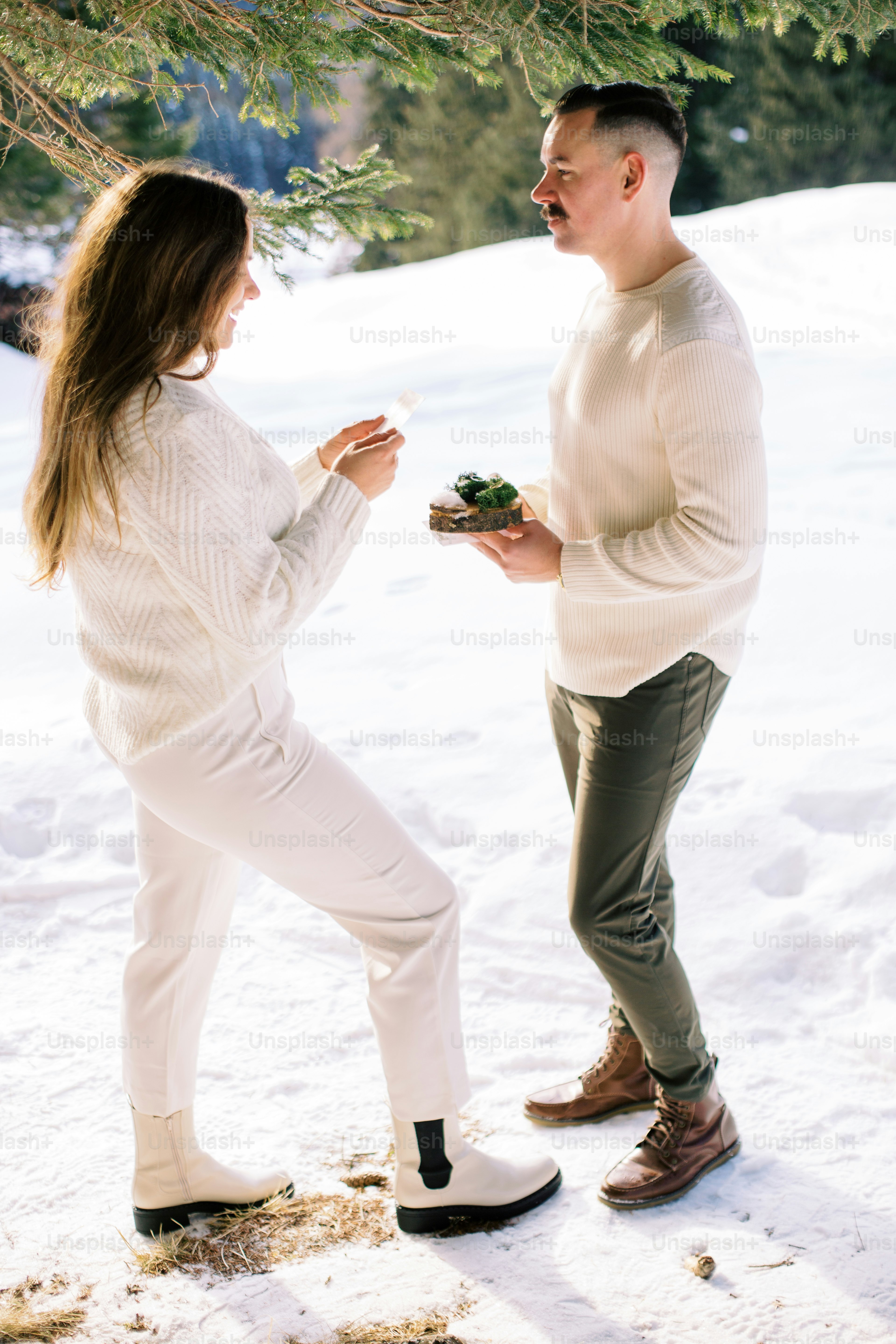 A man and a woman standing in the snow photo – Forest Image on Unsplash