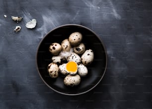 a bowl of quails with an egg in it