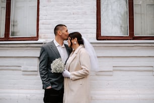 a man and a woman standing next to each other