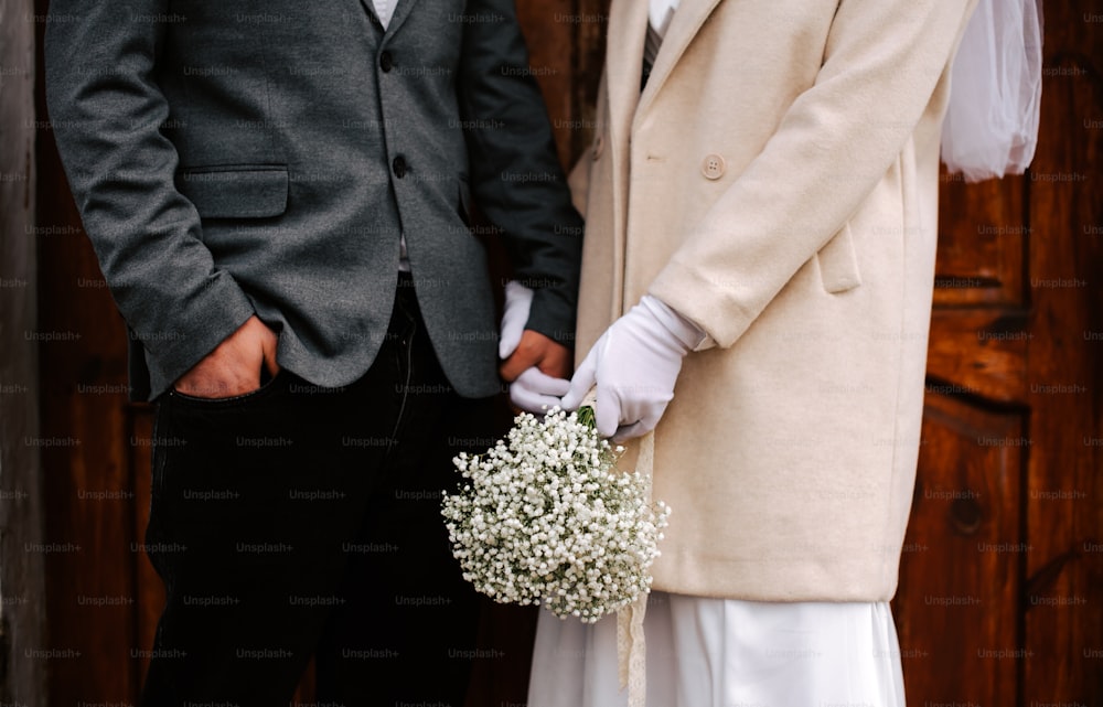 a bride and groom standing next to each other