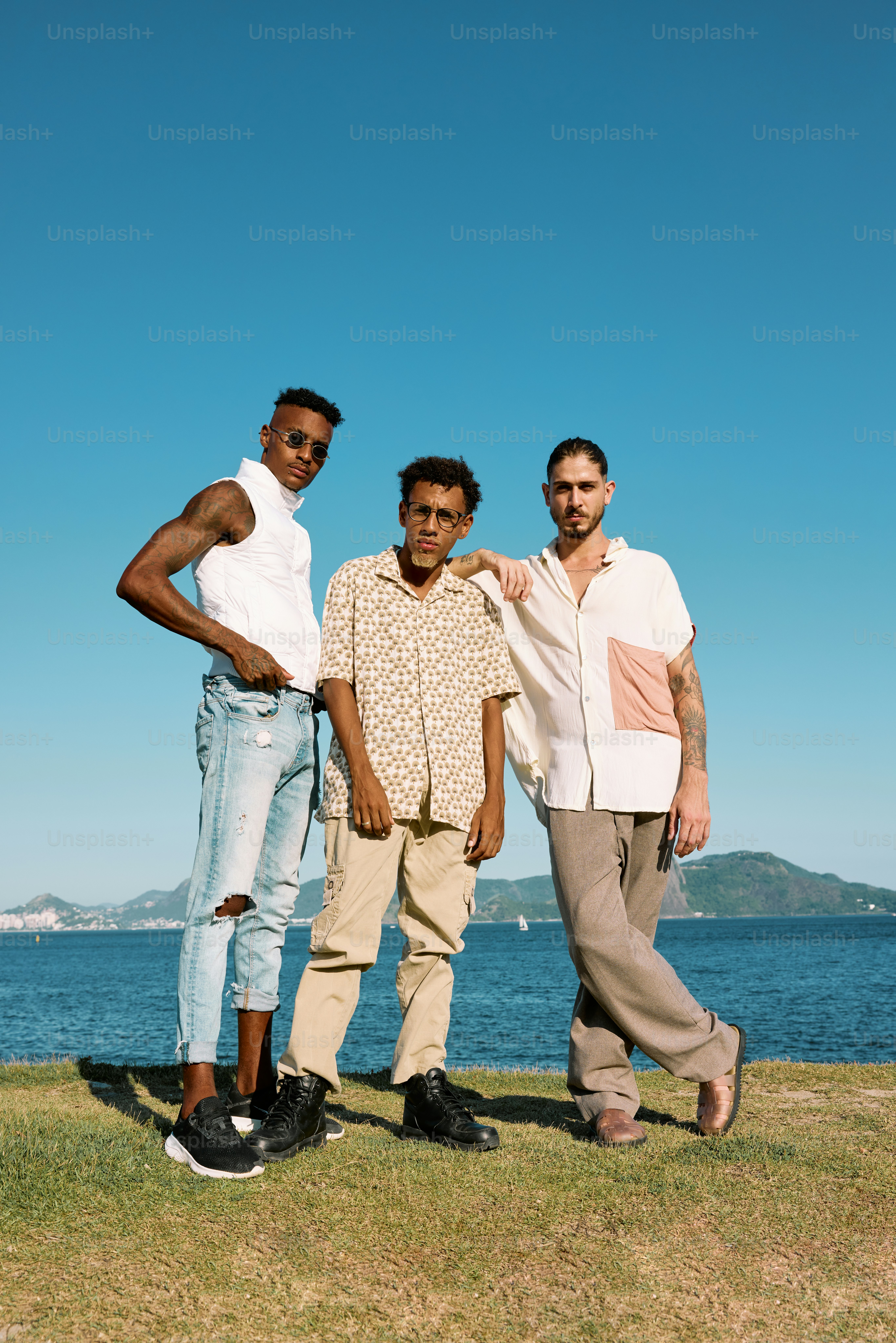 a group of three men standing next to each other
