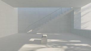 une salle blanche avec des escaliers et une table blanche