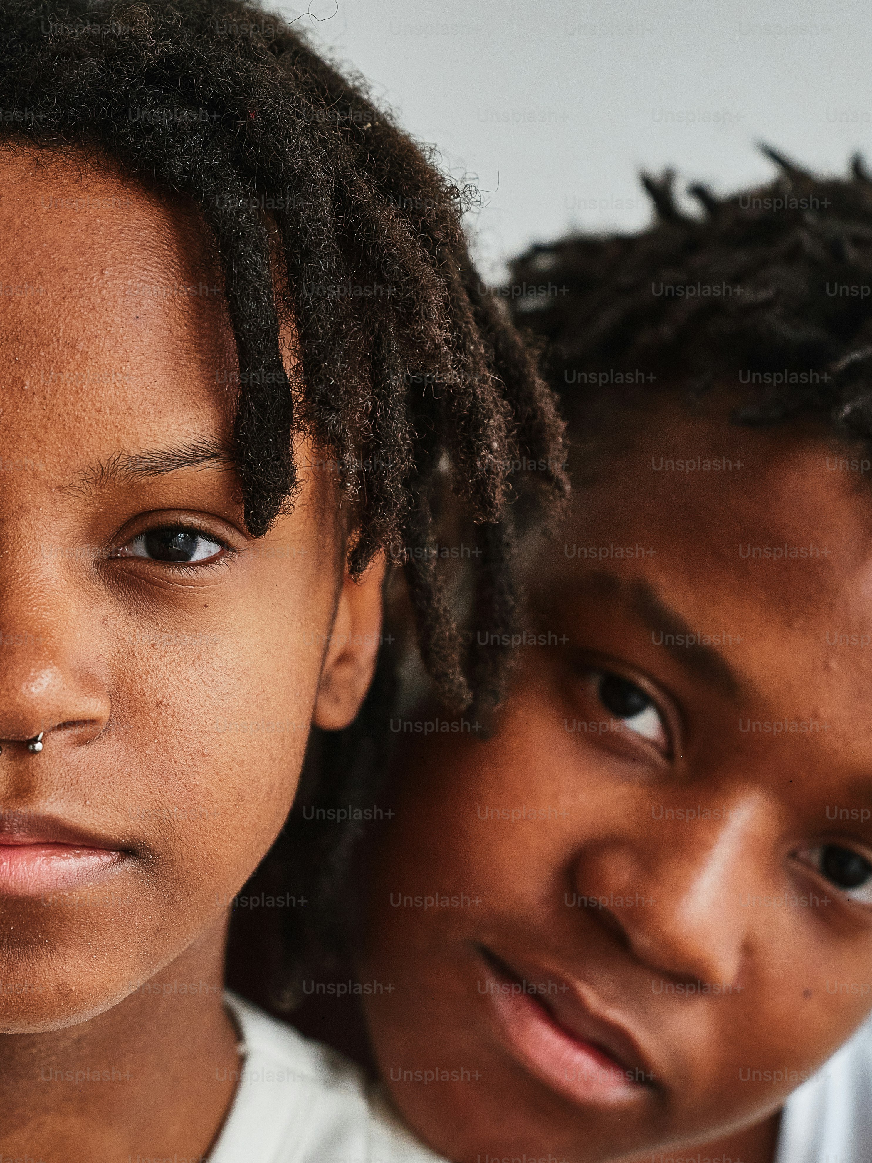 a couple of young people standing next to each other
