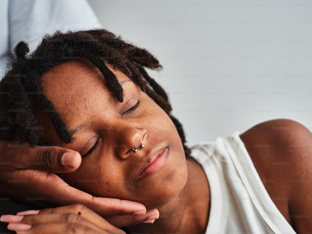 a close up of a person with dreadlocks