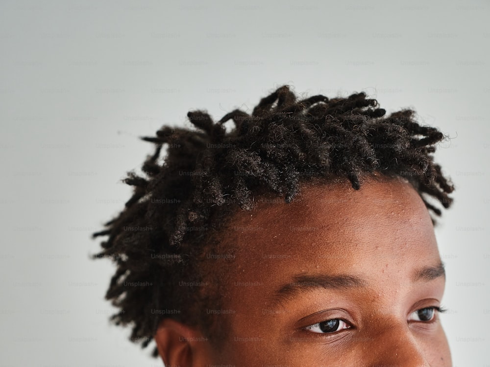 a close up of a person with dreadlocks