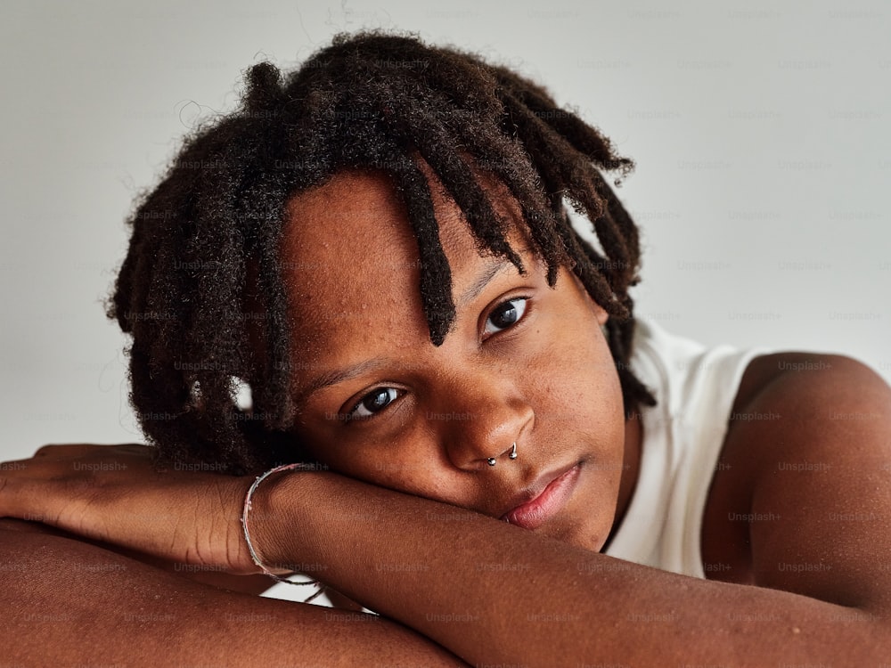 a close up of a person with dreadlocks