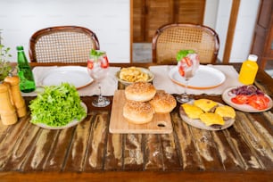 a wooden table topped with plates of food