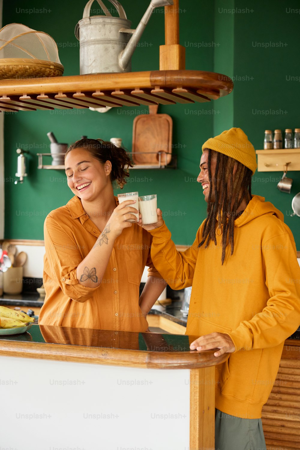 a man and a woman standing in a kitchen