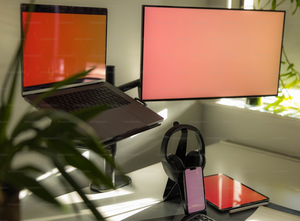 a laptop computer sitting on top of a desk