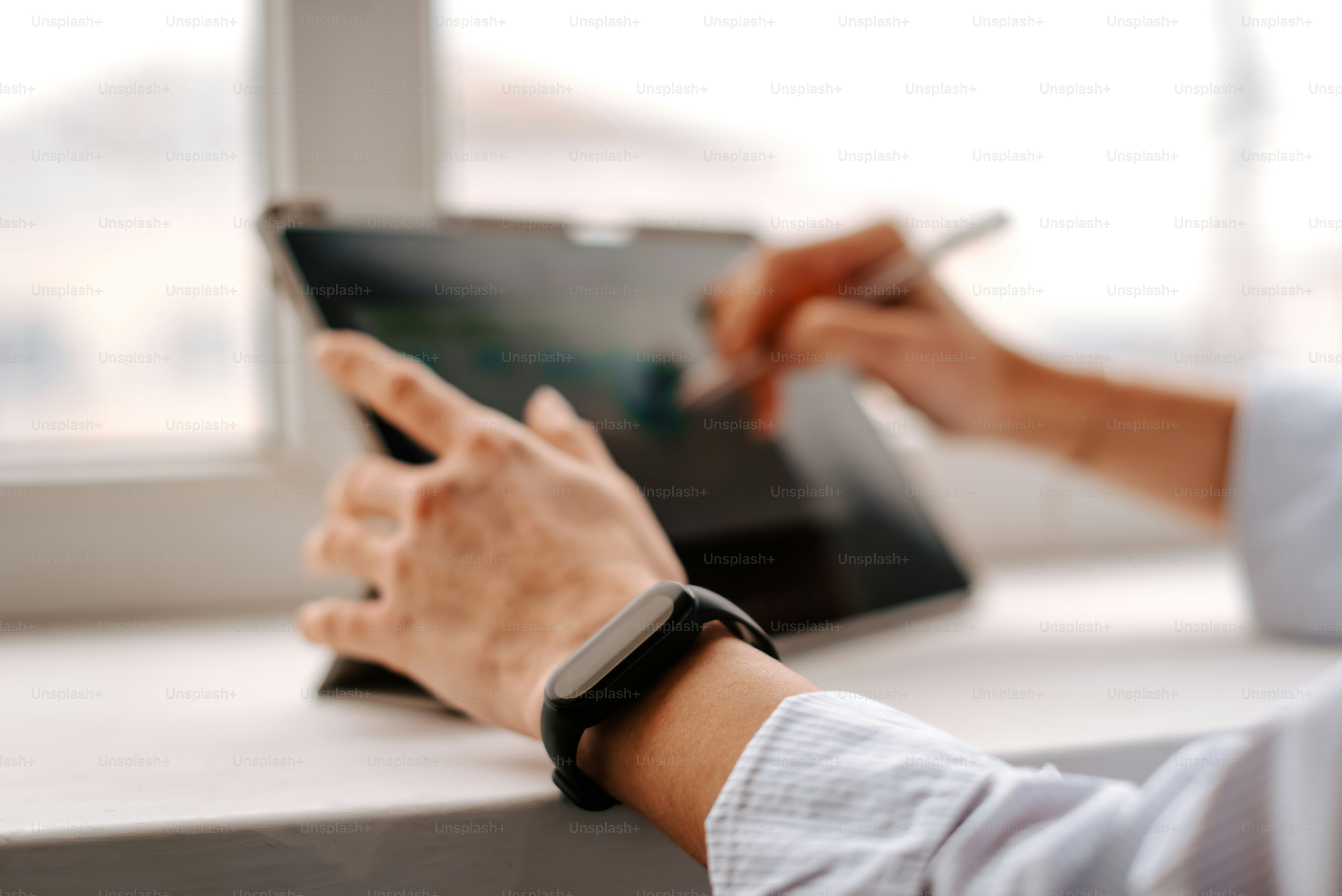 a person using a tablet on a table