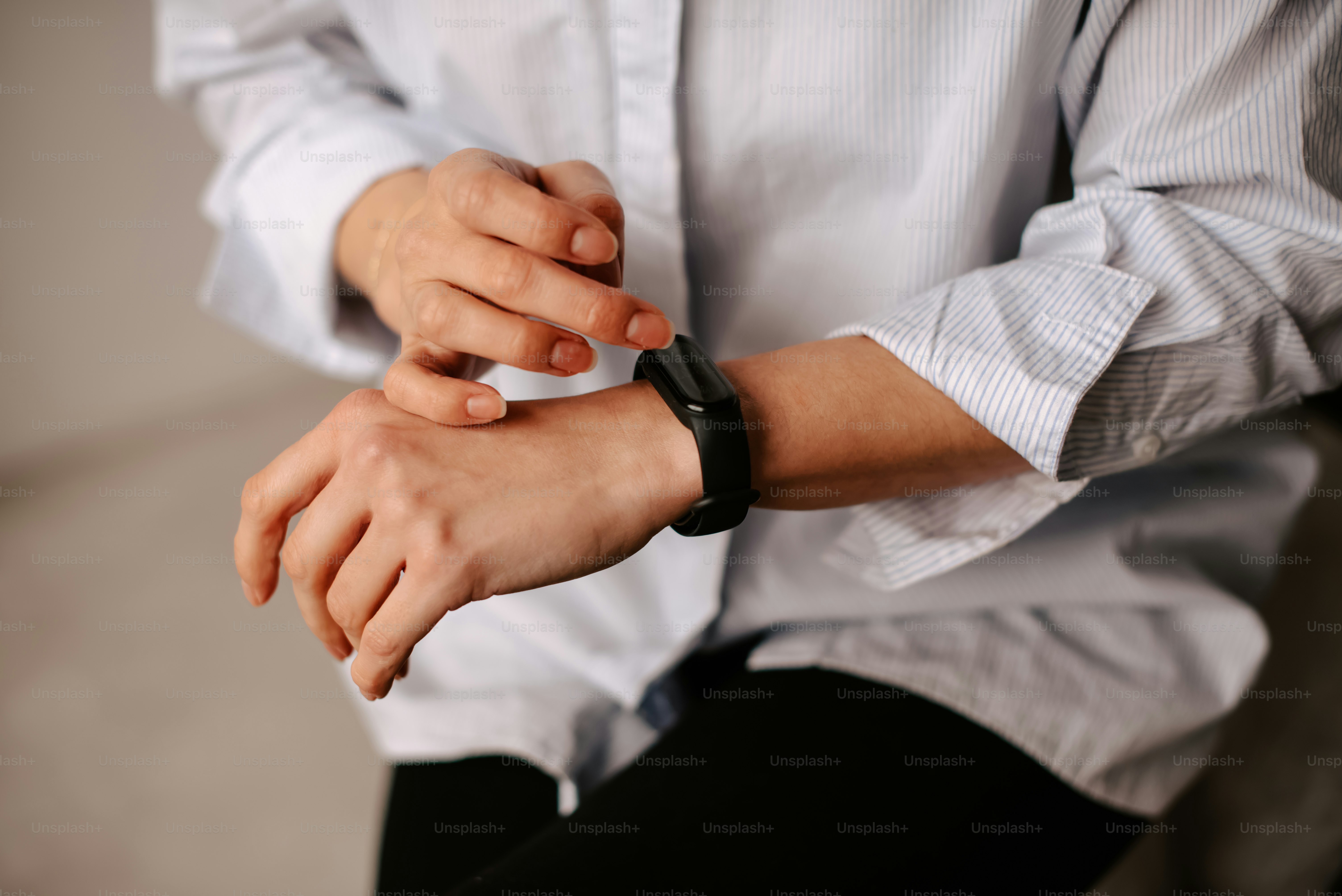 a person with a watch on their wrist