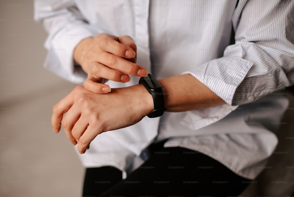 a person with a watch on their wrist