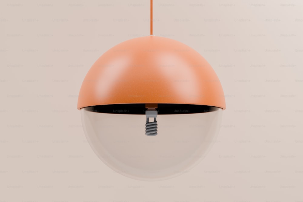 an orange and white light hanging from a ceiling