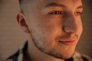 a close up of a man with freckled hair