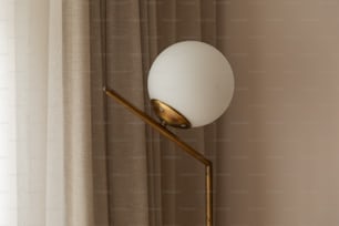 a lamp that is next to a curtain