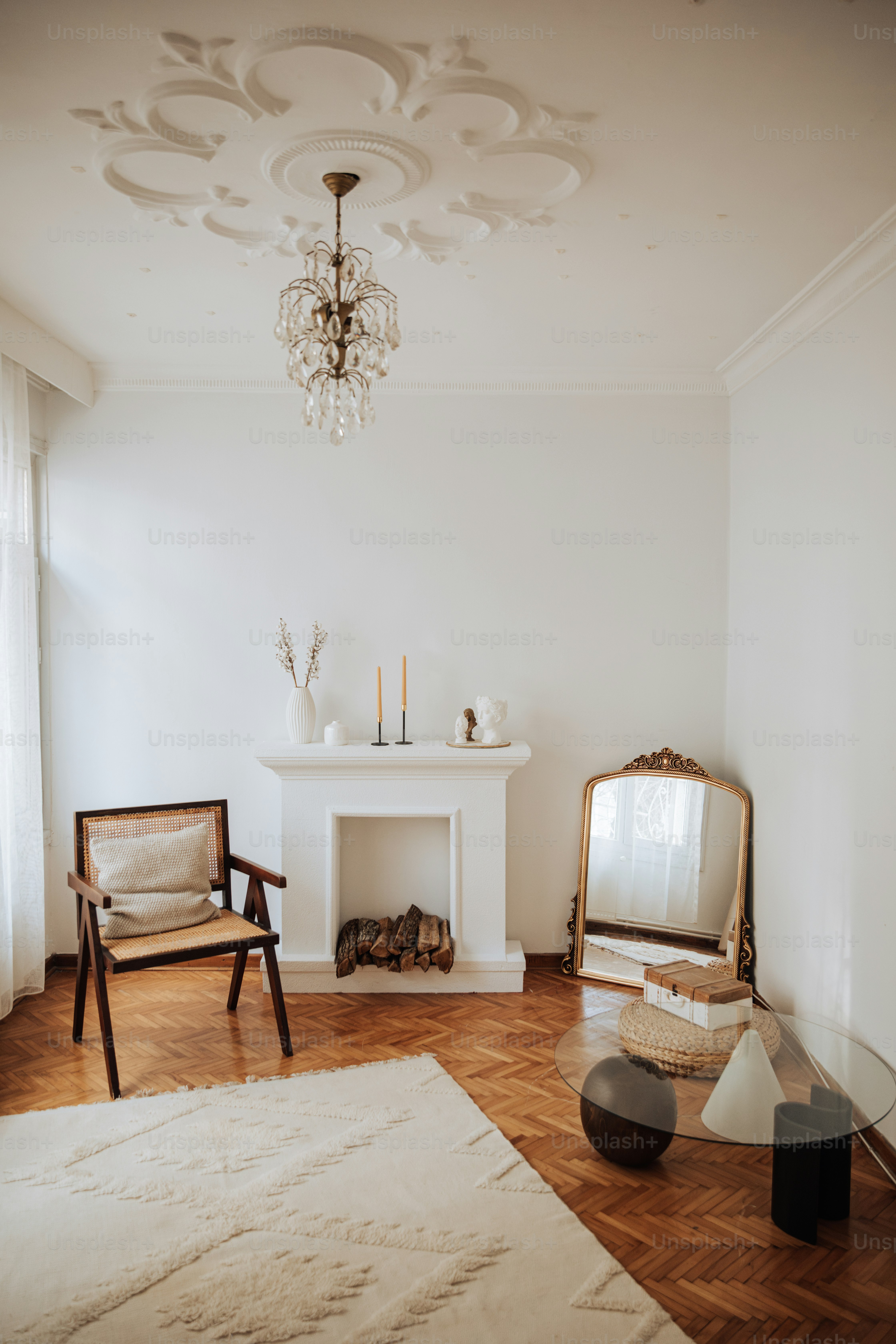 a living room with a fireplace and a chair