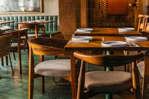 a dining room with wooden tables and chairs