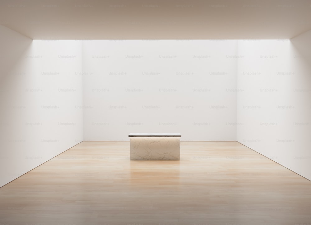 an empty room with a bench in the middle of it