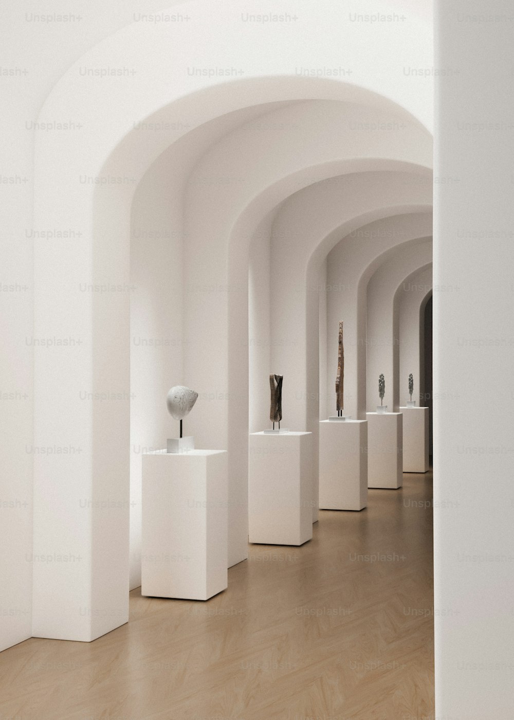 a row of white vases sitting on top of white pedestals