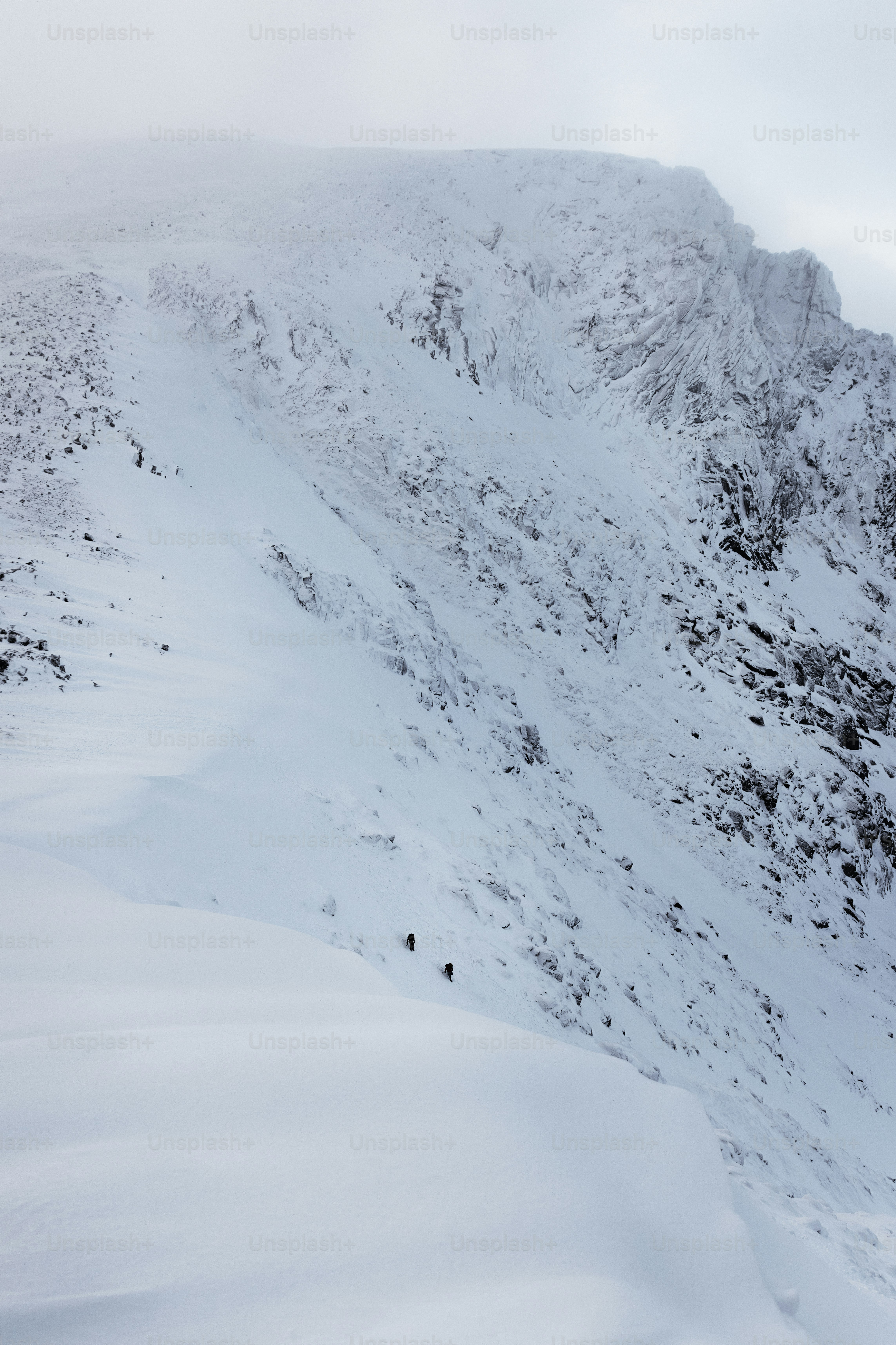 a person skiing down a snowy mountain side
