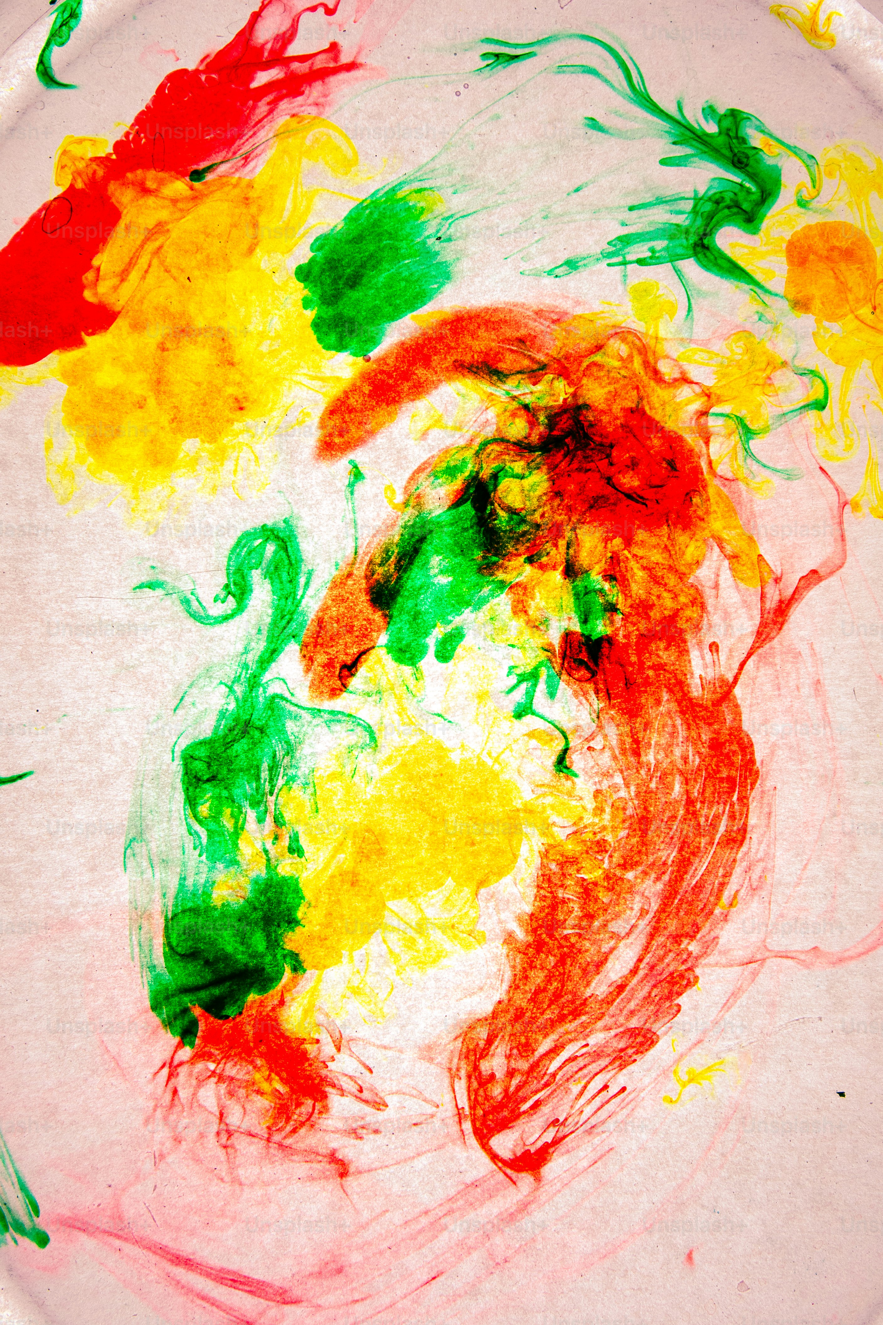 a paper plate that has some paint on it