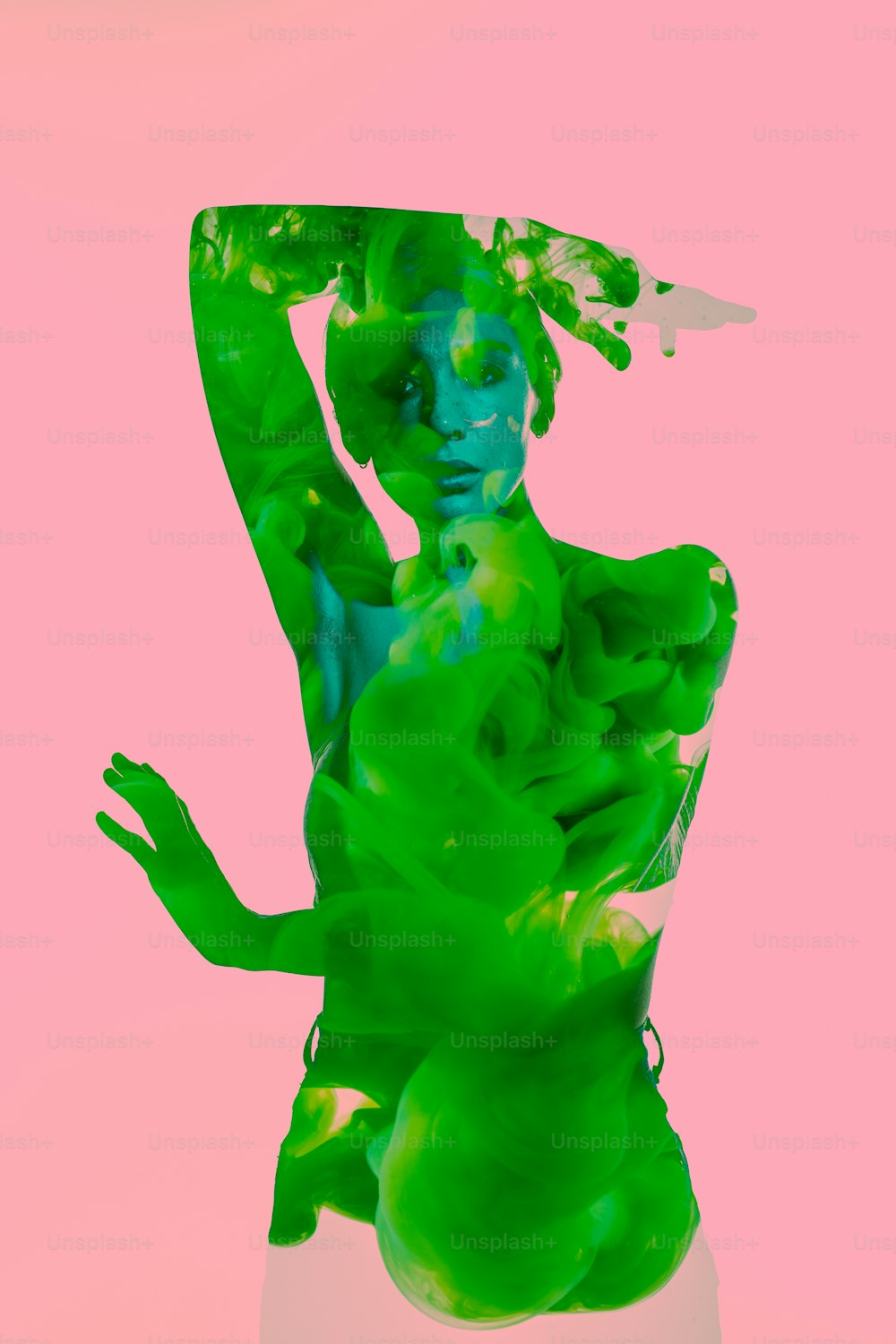 a woman with green paint on her body