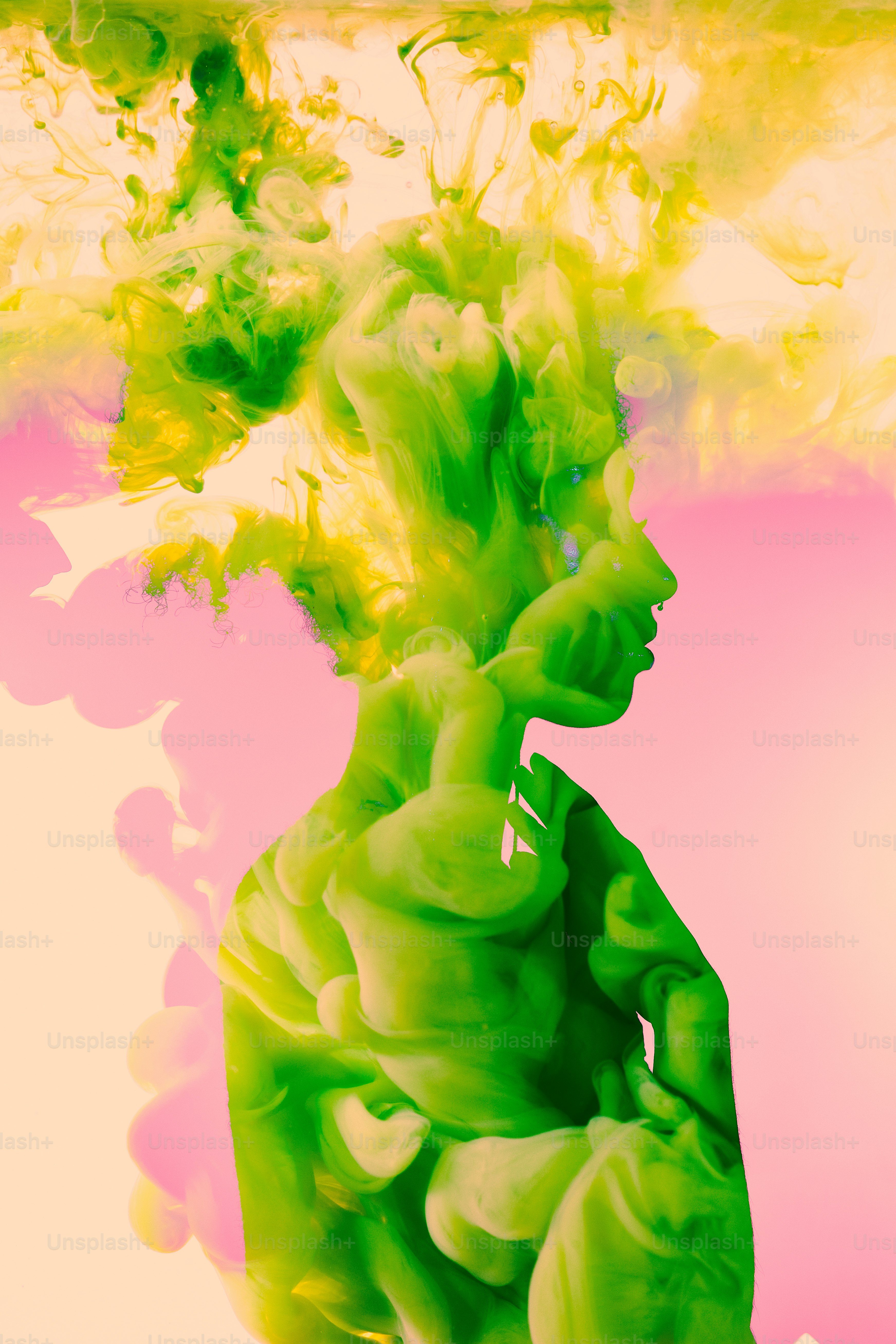 a woman's face is covered in green ink