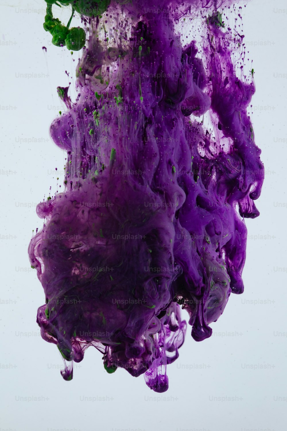 a purple substance is floating in the air