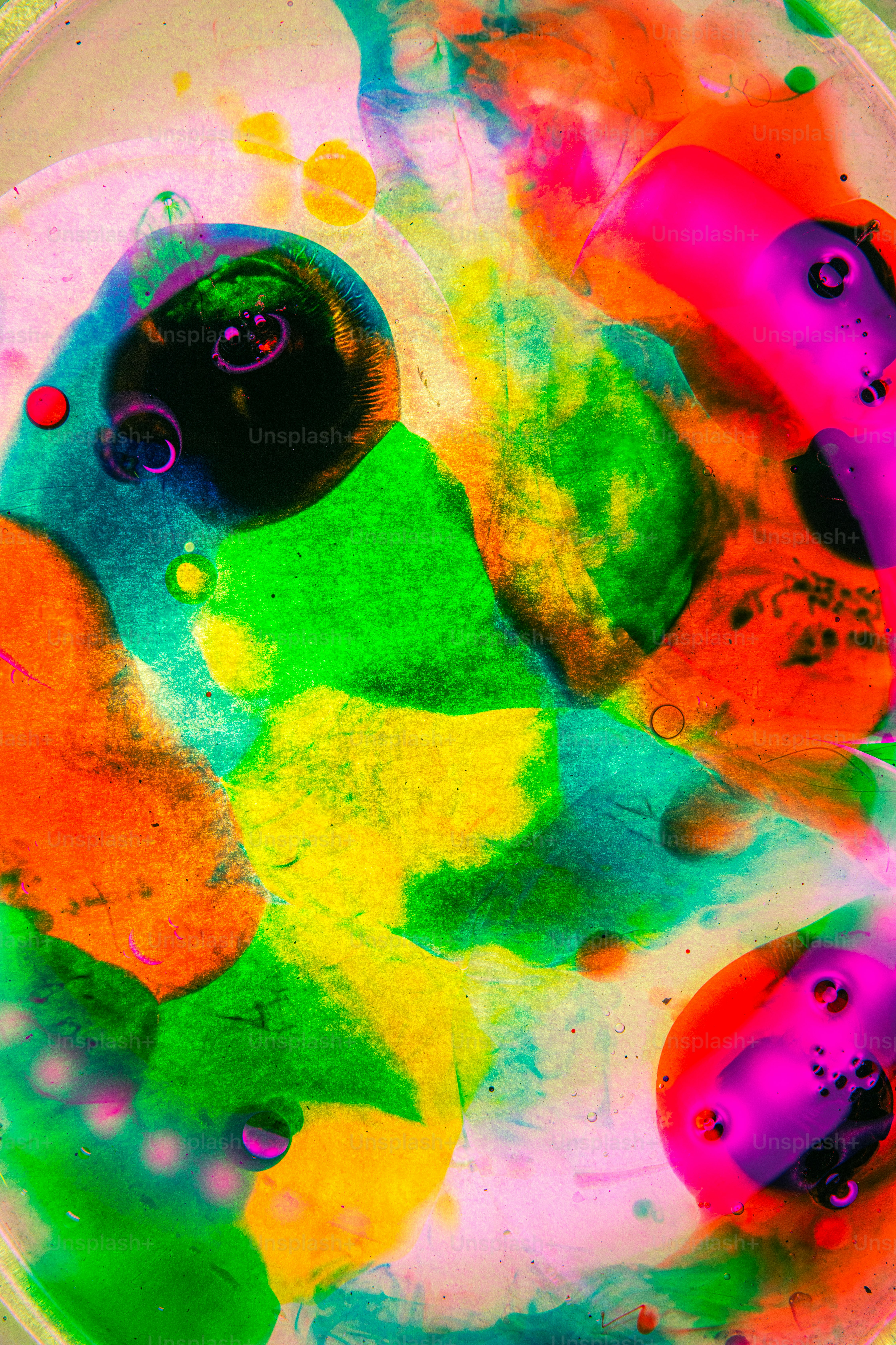 a bowl filled with lots of different colored paint