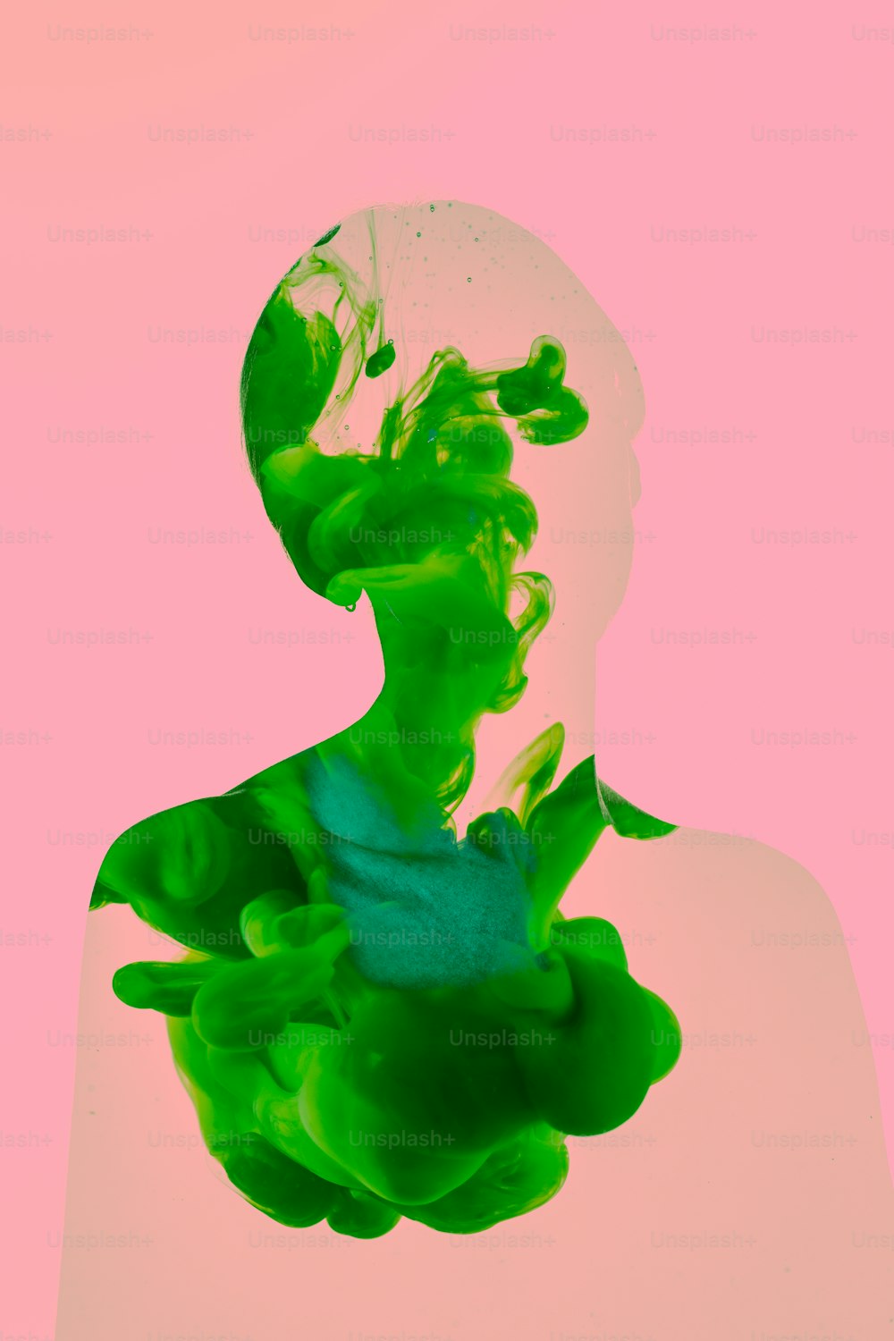 a woman's face is covered in green paint