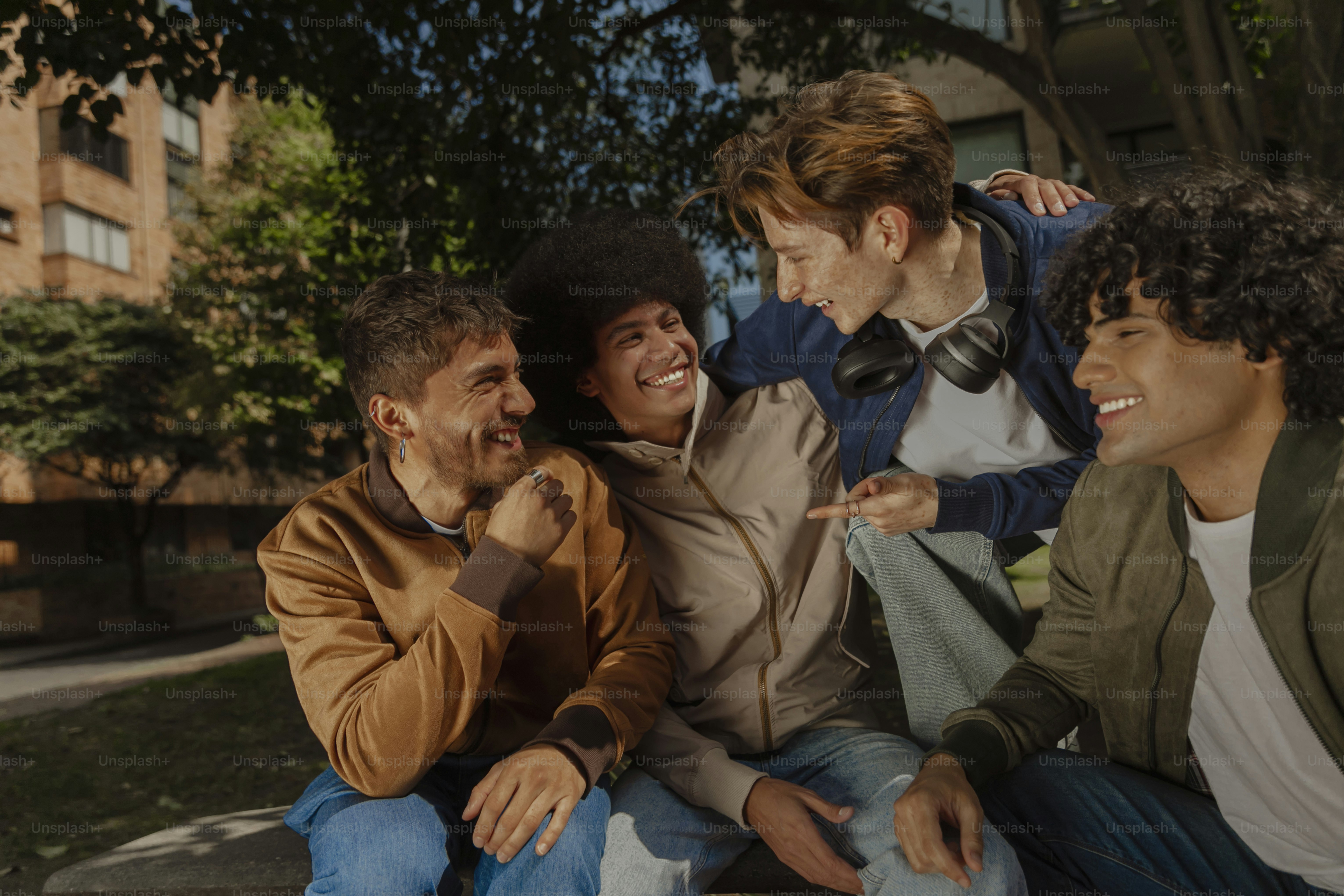a group of young men sitting next to each other