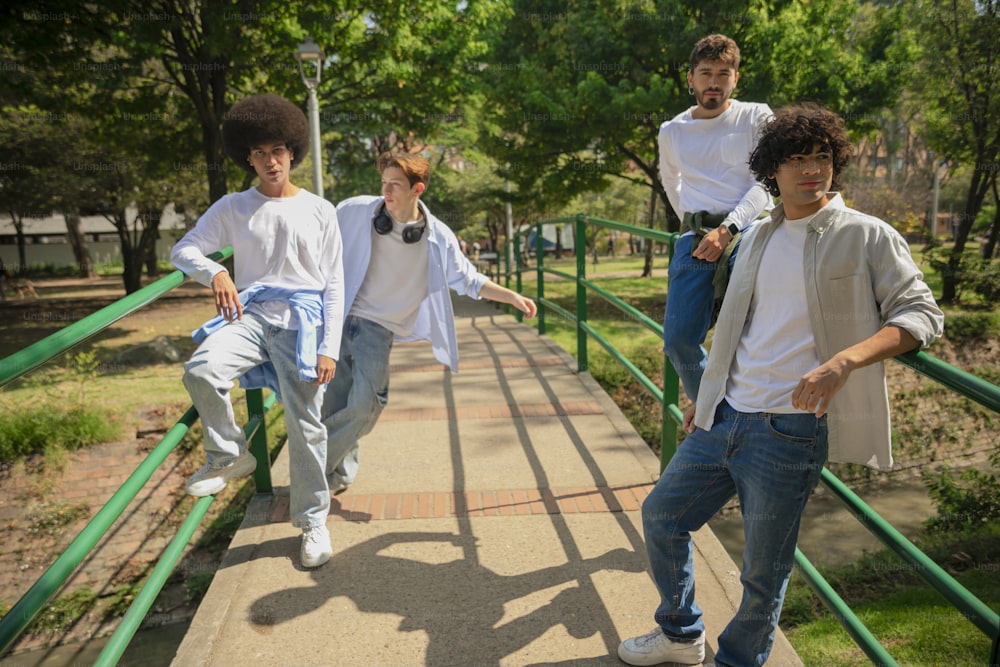 a group of young men walking across a bridge