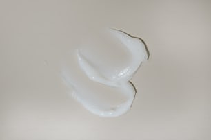 a close up of a white liquid in a glass