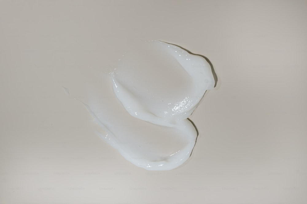 a close up of a white liquid in a glass