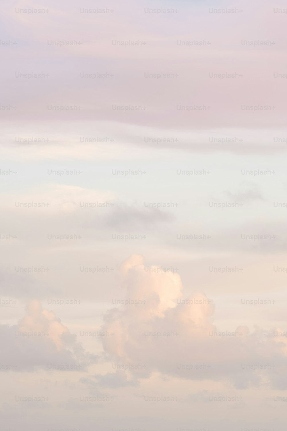 a group of people standing on top of a beach