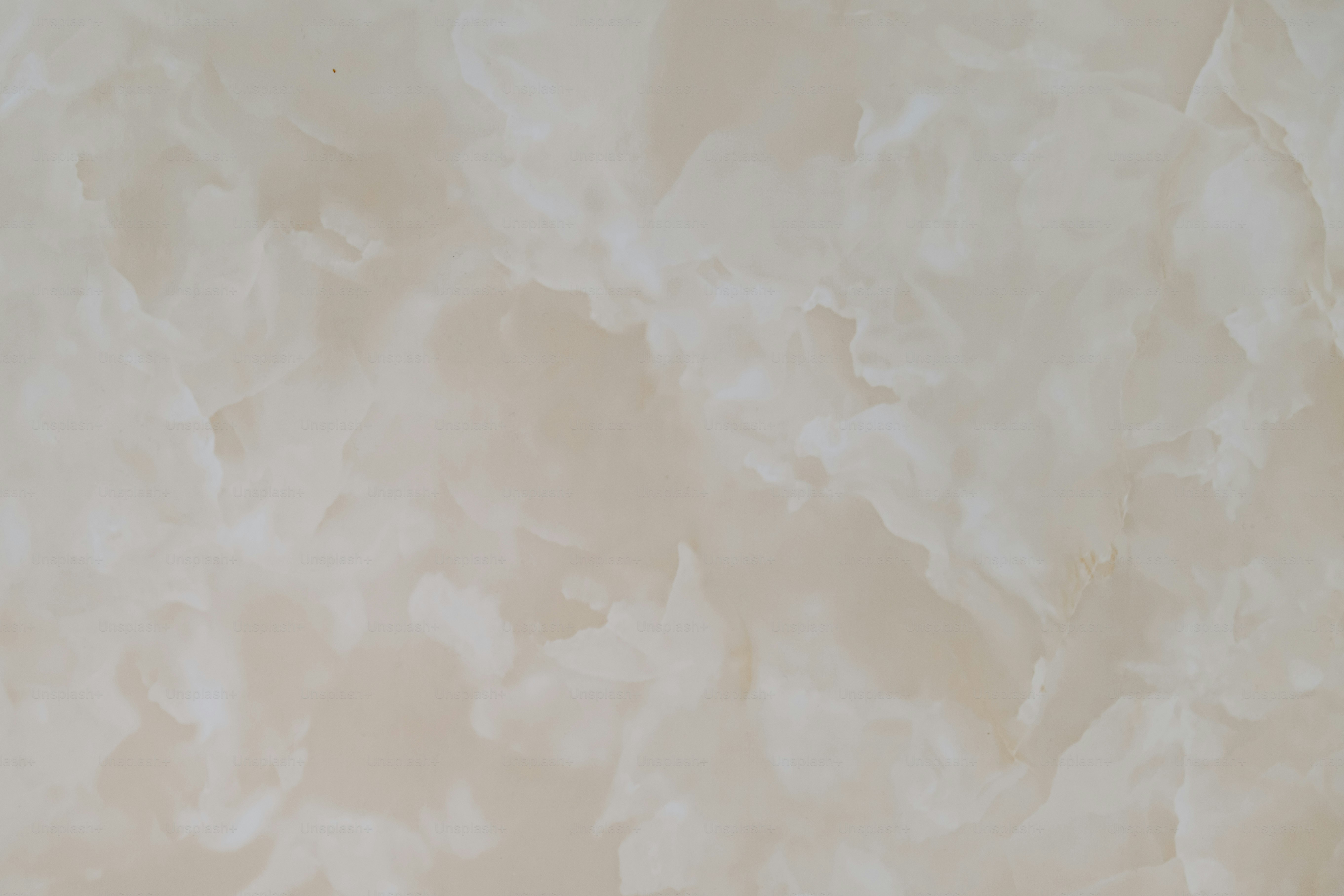 a close up of a white marble wall
