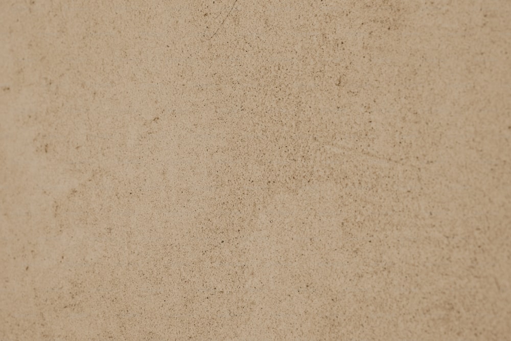 a close up view of a tan colored surface