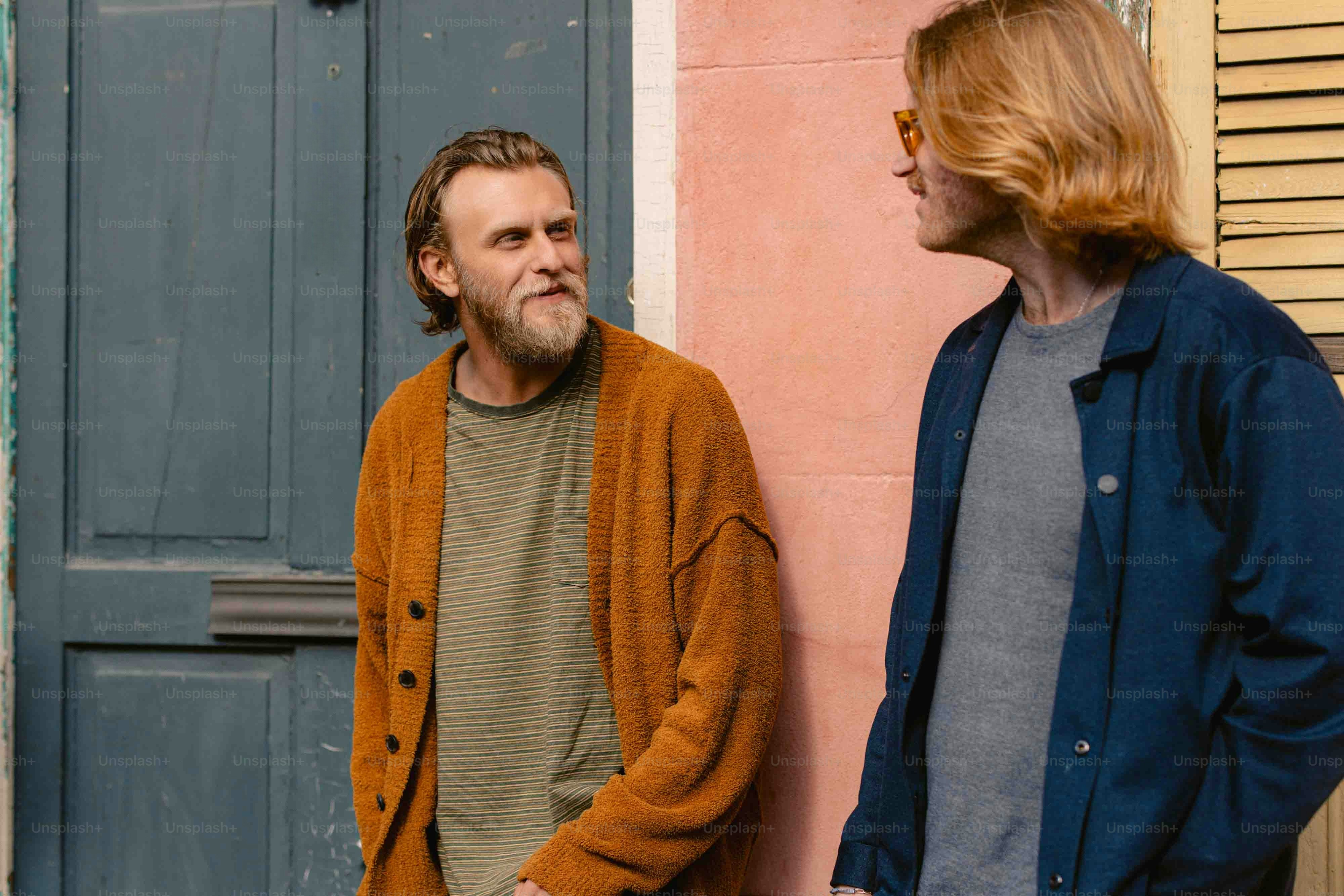 a man standing next to a woman in front of a door