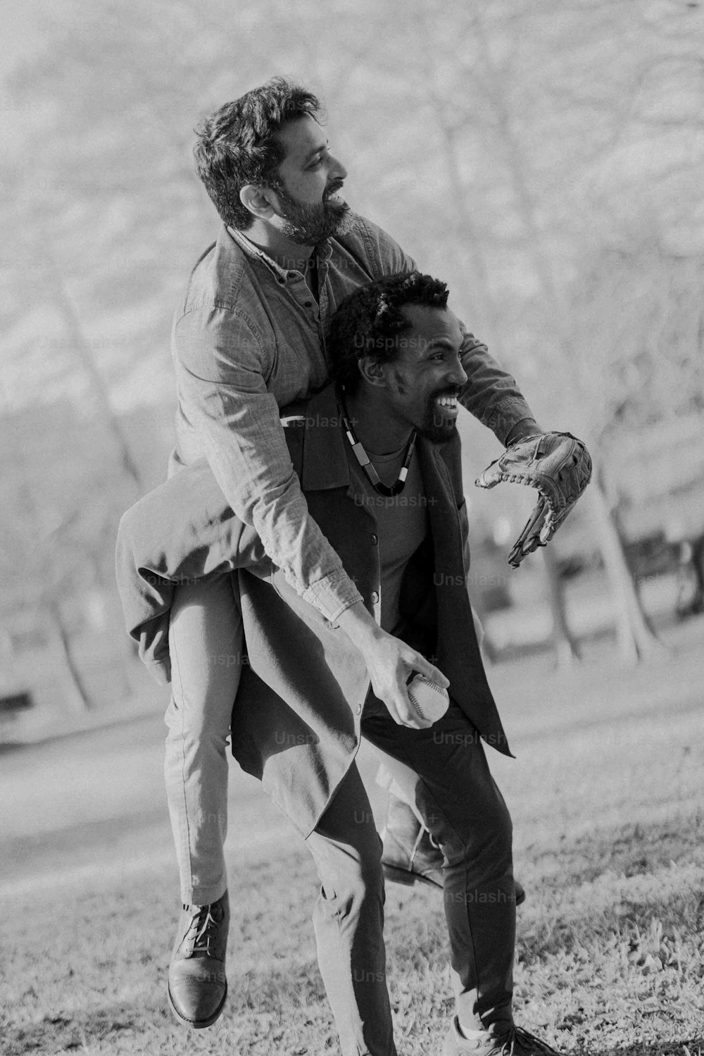a man carrying a woman on his back