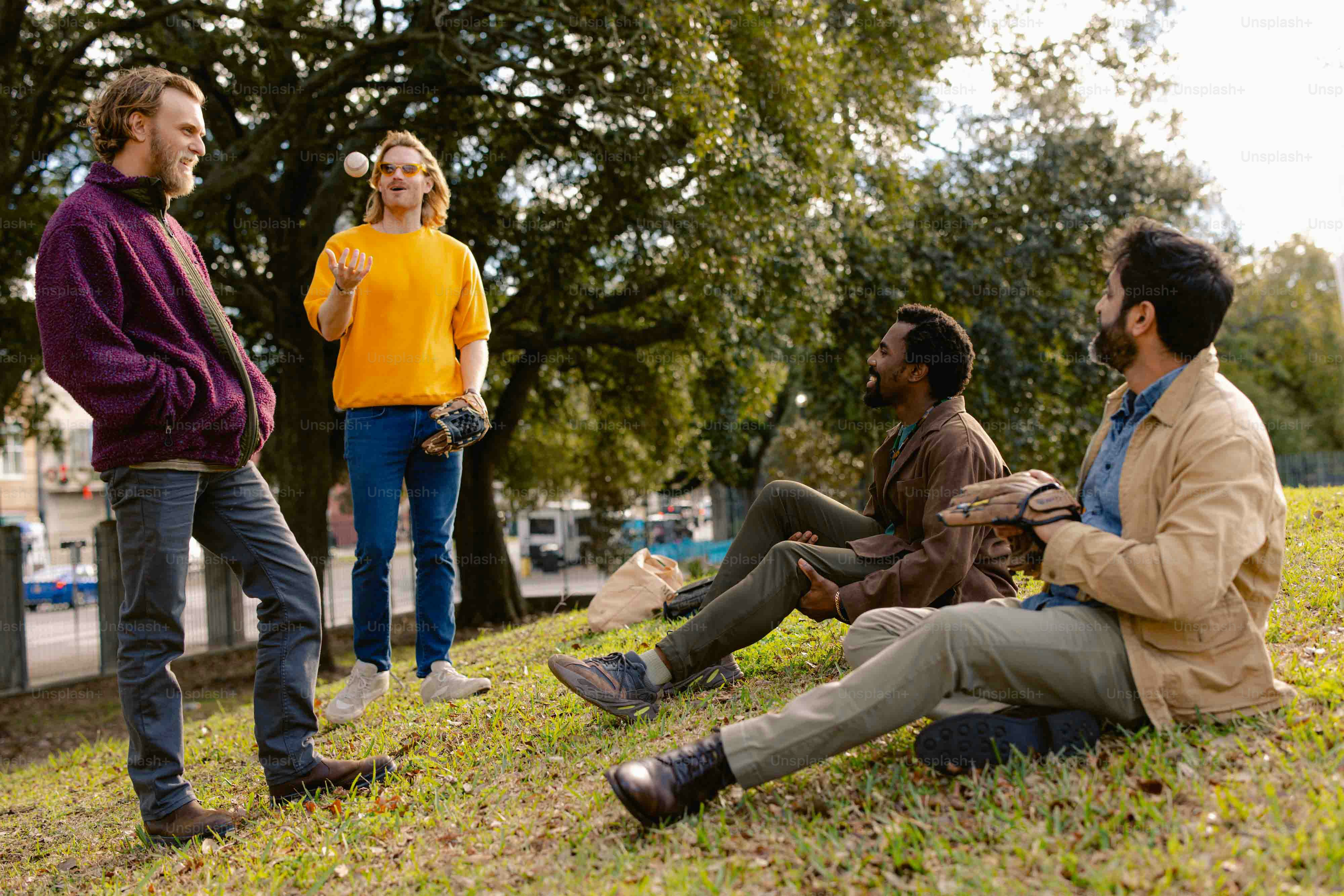 A group of people sitting on the grass photo – Outdoor Image on Unsplash