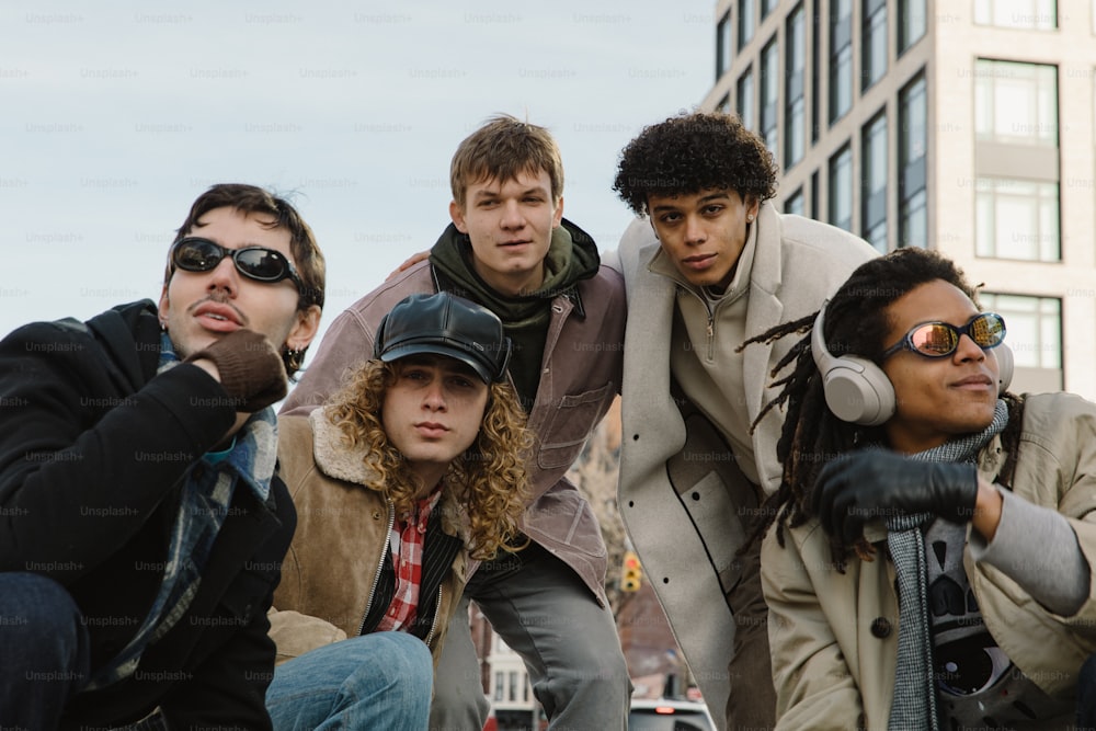 a group of young men sitting next to each other